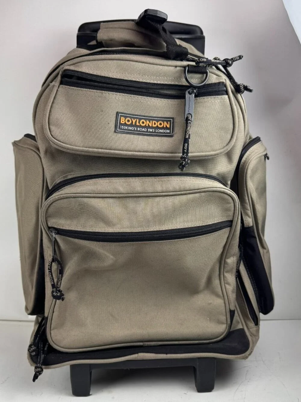boy london rolling backpack tan wheeled suitcase travel bag tear fraying flaw
